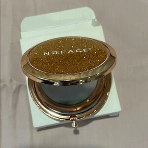 NuFace Shimmering rose gold Compact